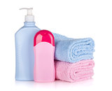 Shampoo and gel bottles with towels