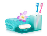 Toothbrushes, soap, towel and flower