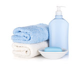 Shampoo bottle and soap with towels