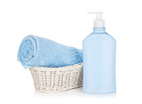 Shampoo bottle and blue towel