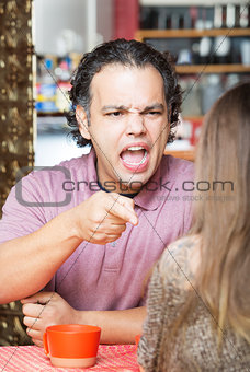 Angry Man Pointing at Woman