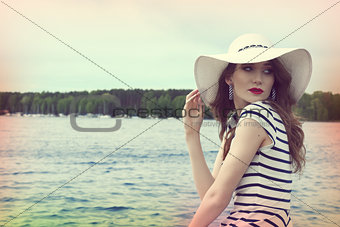 pretty girl in a commercial shot outside near sea color vintage 