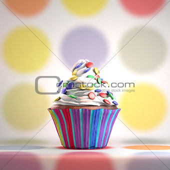 Delicious cupcake with smarties on a whipped cream.