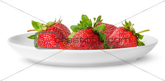 Several pieces of strawberry on white plate