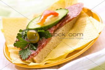 sandwich with salami, bread and butter