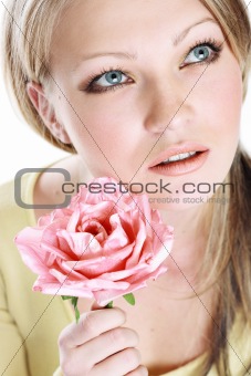 the portrait of the beautiful girl on white background with flower