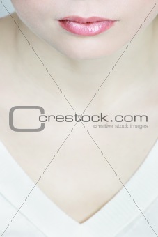 Half face of a women, neck and pink lips