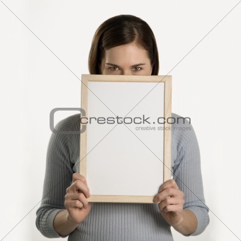 Woman holding blank sign.