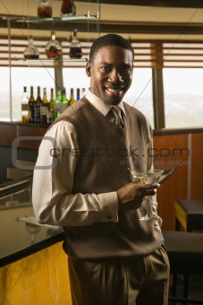 Man drinking martini.