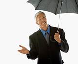 Businessman with umbrella.