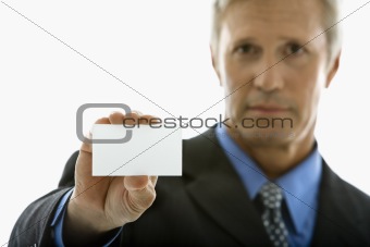Man holding business card.