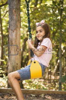 Girl swinging.