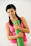 Woman with exercise mat