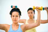 Women lifting hand weights