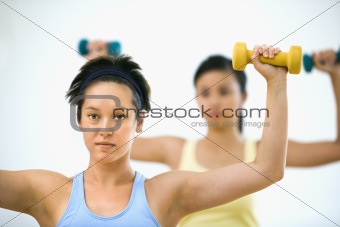 Women lifting hand weights