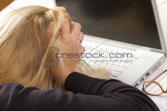 Frustrated Female Using Laptop