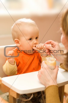 Feeding a little baby boy