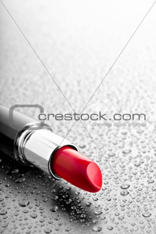 lipstick closeup with desatured water drops