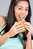 Latina girl eating burger