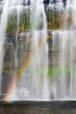 Tropical waterfall with rainbow