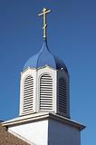 Church steeple against a blue sky