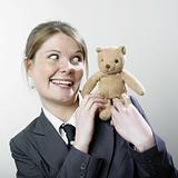 Woman playing with teddy