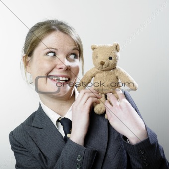 Woman playing with teddy