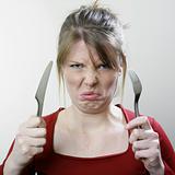 Unhappy face with cutlery