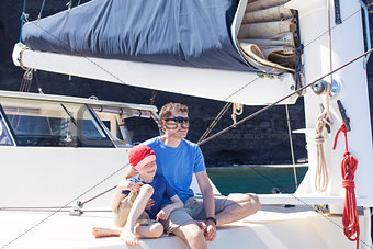 family at sailing boat