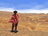 Men in a poncho in the desert