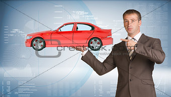 Businessman holding car