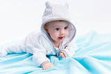 baby in the hood on a blue blanket