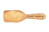 Brown cane sugar on shovel