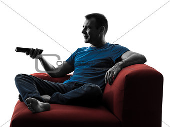 man sofa coach remote control watching tv