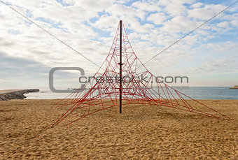 Rope pyramid playground in the beach