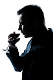 silhouette man portrait smelling red wine glass