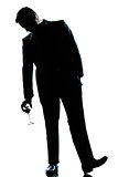 man drunk holding a glass of red  wine silhouette