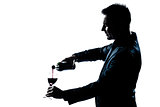 man portrait pouring wine in a glass  silhouette