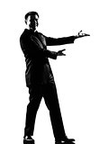 silhouette  man  showing gesture introducing presentation