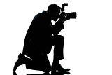 silhouette man kneeling photographer