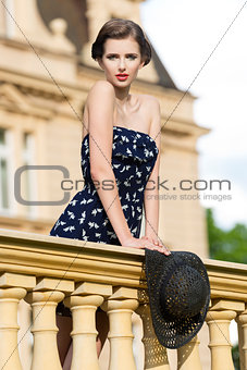 fashion woman on ancient balcony 