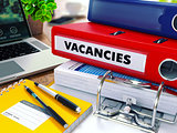 Vacancies on Red Ring Binder. Blurred, Toned Image.
