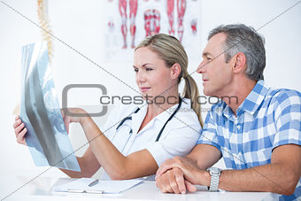 Doctor showing X rays to her patient