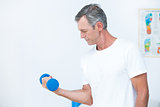 Patient lifting dumbbell