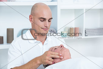 Man receiving head massage