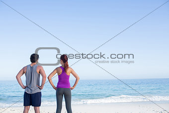 Happy couple looking at the sea