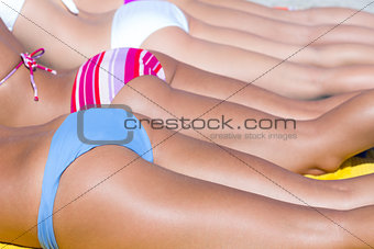 Girls in bikini sunbathing