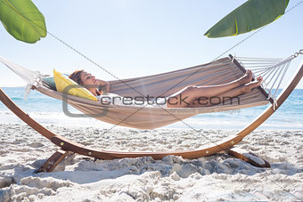 Brunette relaxing in the hammock