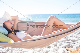 Brunette relaxing in the hammock