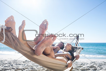 Happy couple napping together in the hammock